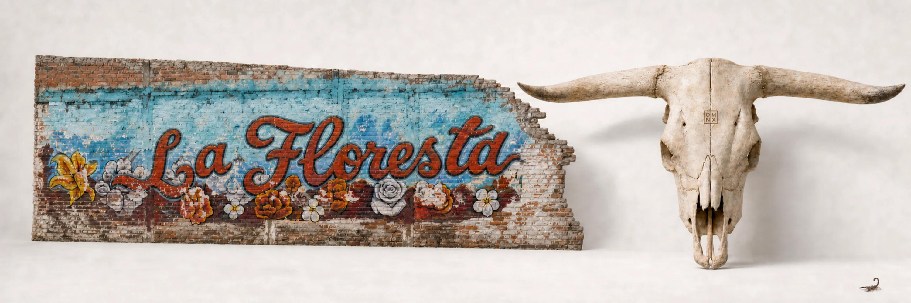 A weathered brick wall hand-painted with the words La Floresta in vintage script, beside a longhorn skull branded with the OMNX mark.